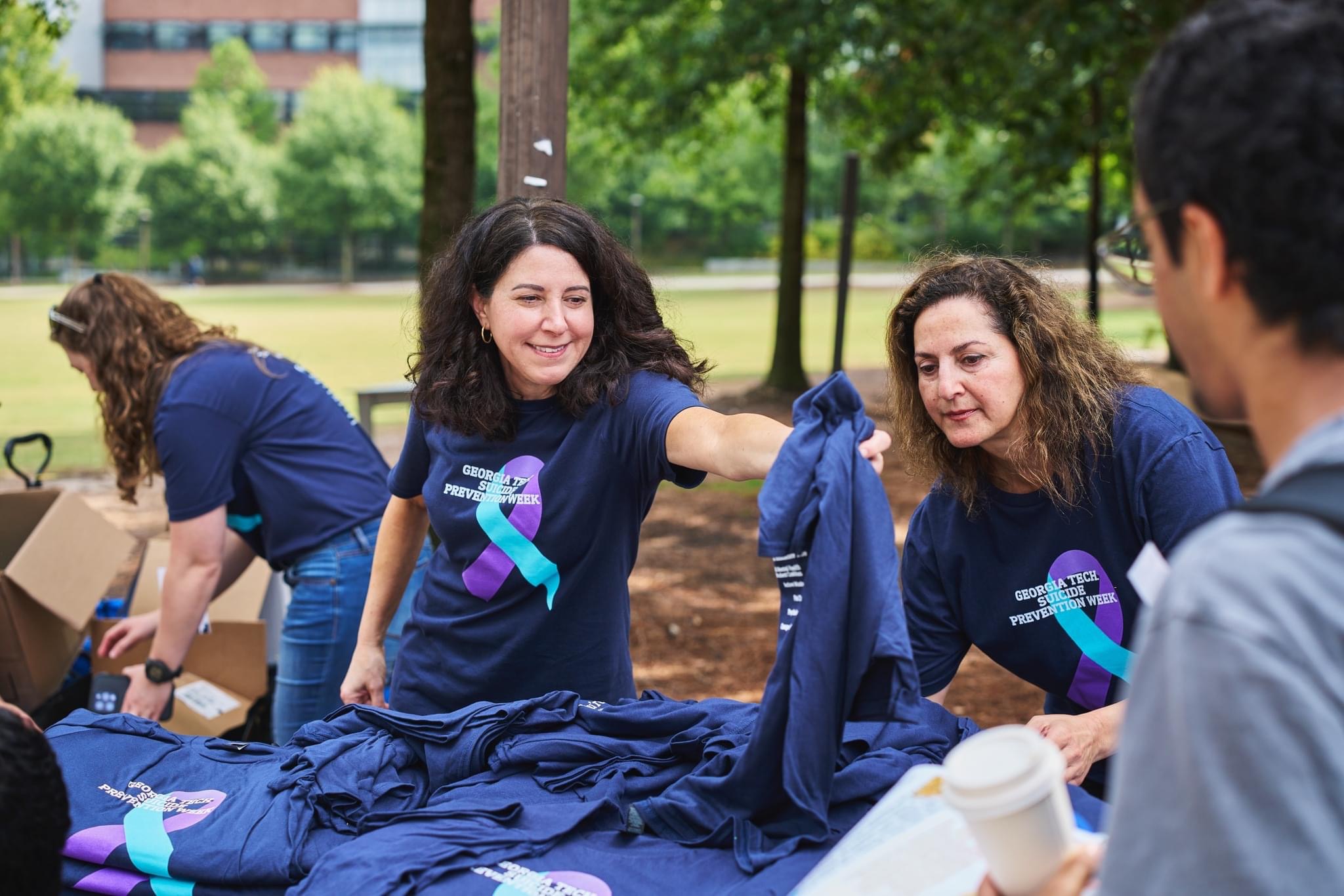 handing out tshirts